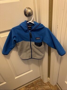Patagonia 6-12 months- Blue & Gray Hooded Fleece Jacket, Gently Used Condition.